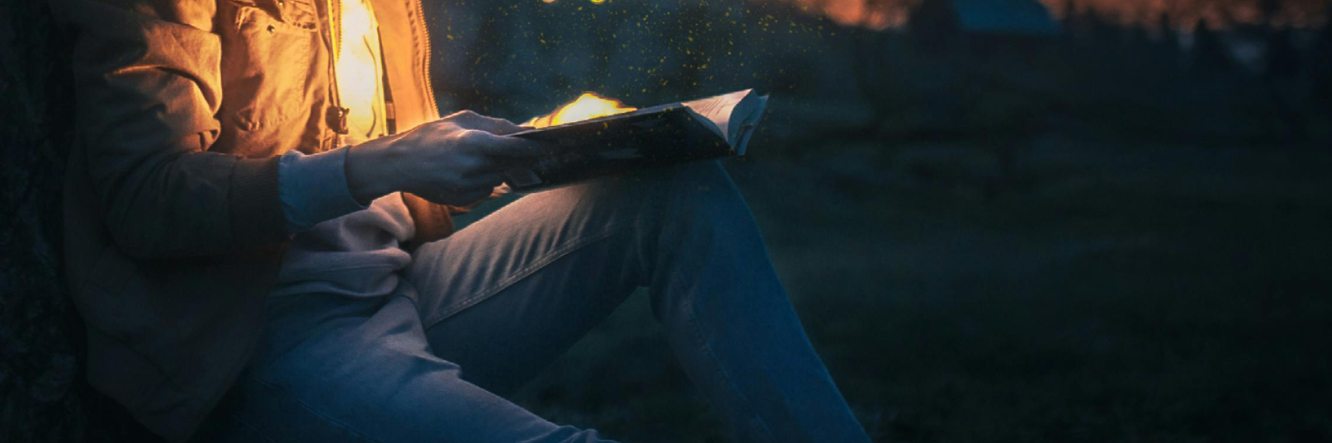 A cowboy reading a book