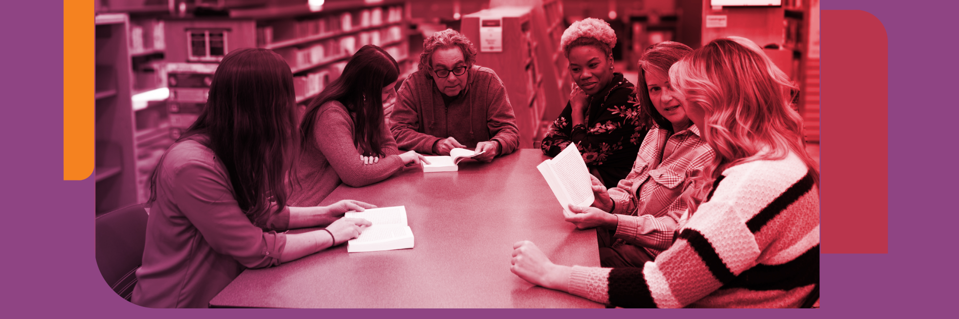A group of people at a table discussing a book