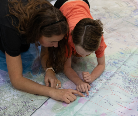 OPL clients looking at the Indigenous Atlas. 