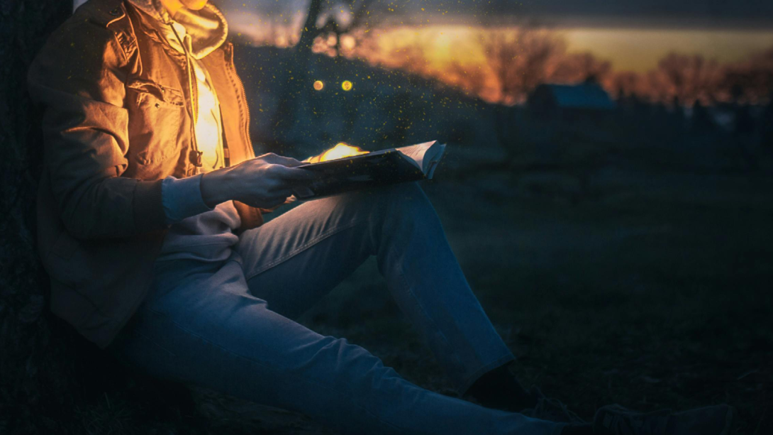 A cowboy reading a book